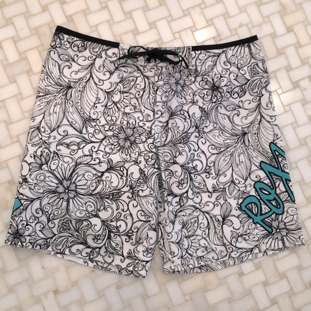 Roxy board shorts, black and white floral design with embroidered logo in aqua.
